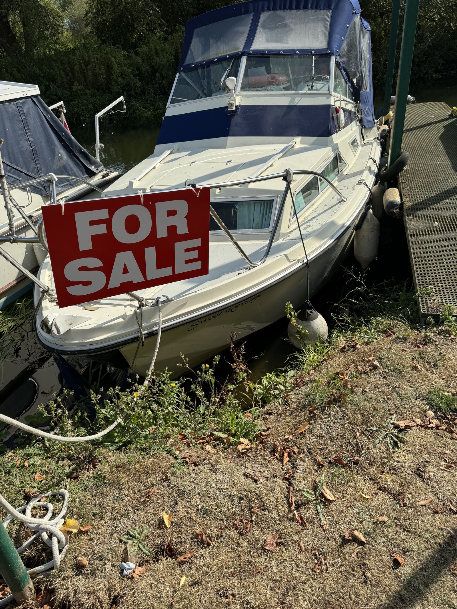 Fairline Holiday 23 foot cruiser “Sweet Revenge” moored at Strensham Mill with a for sale sign on the bow rail.